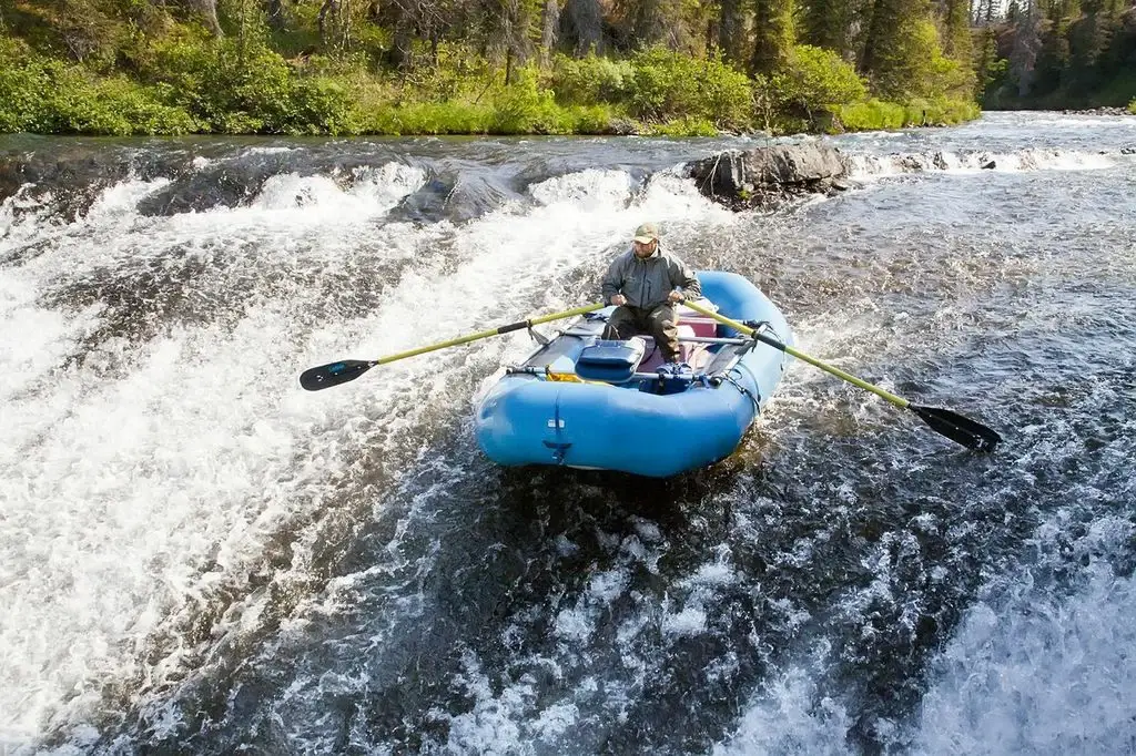 Person rafting on a river - Intricate Bay Lodge