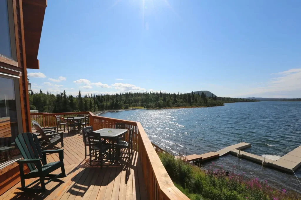 Scenic lakeside deck with chairs - Intricate Bay Lodge